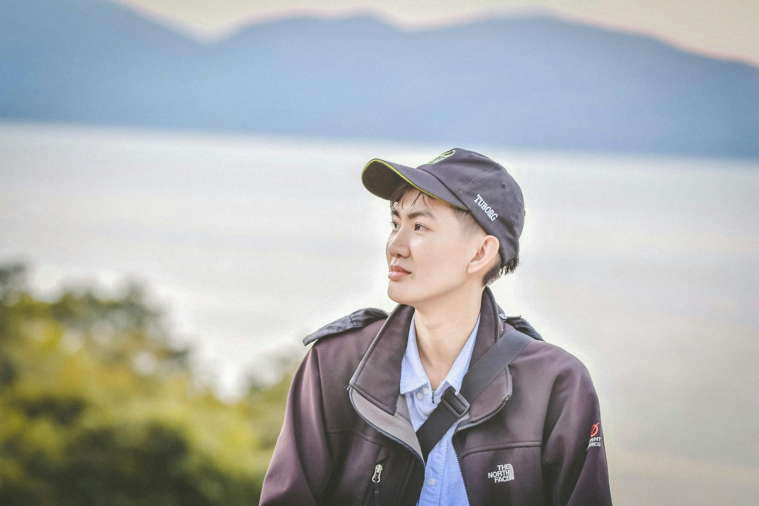 A young traveler enjoys a scenic outdoor view in Da Nang, Vietnam. Perfect for lifestyle and travel themes.